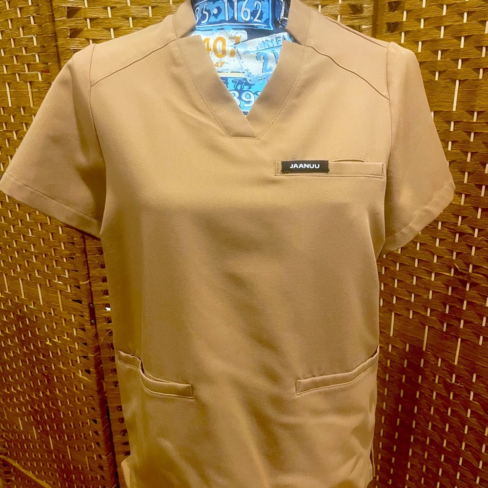 JAANUU BNWOT KHAKI SCRUB TOP, Size XS.